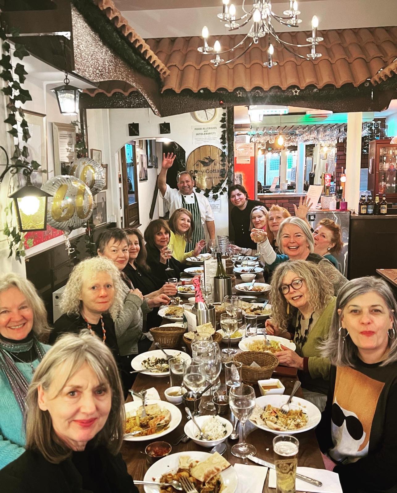Guests celebrating with the Curry Cottage team