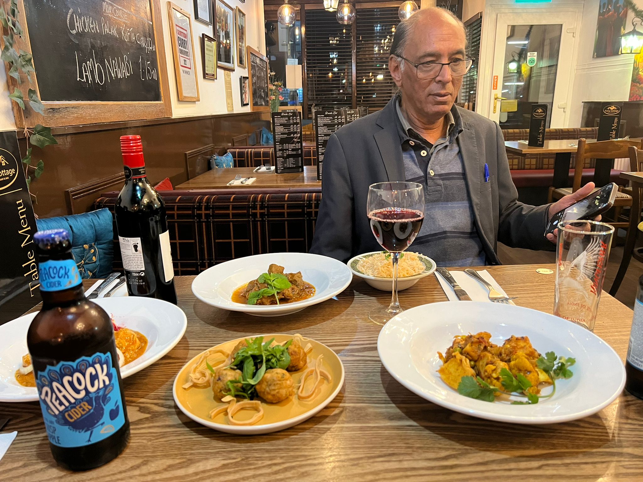 Curries served with wine in the dining room