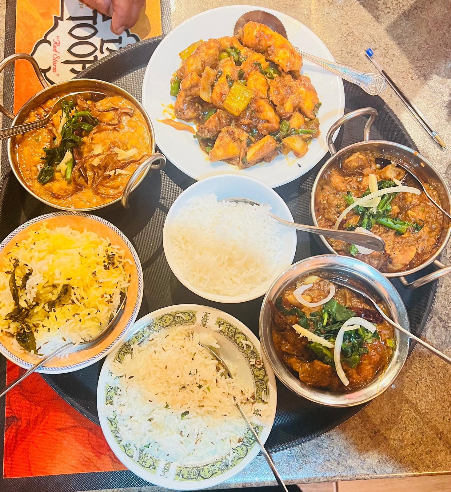 A shared feast of curries and rice