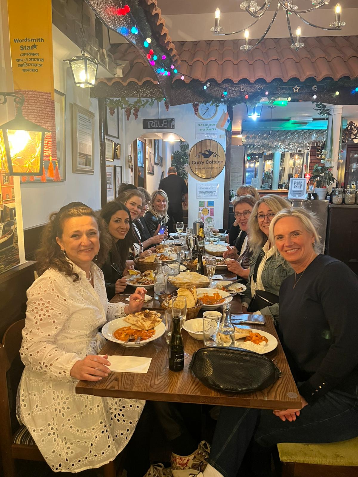 A group of friends gathered around the dinner table